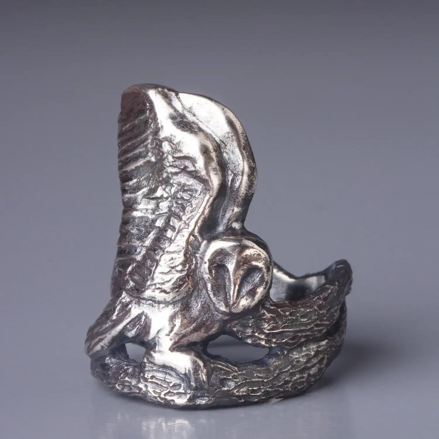 Sterling silver Barn Owl ring with intricate design of an owl spreading wings and sitting on a tree branch, a perfect bird statement ring.