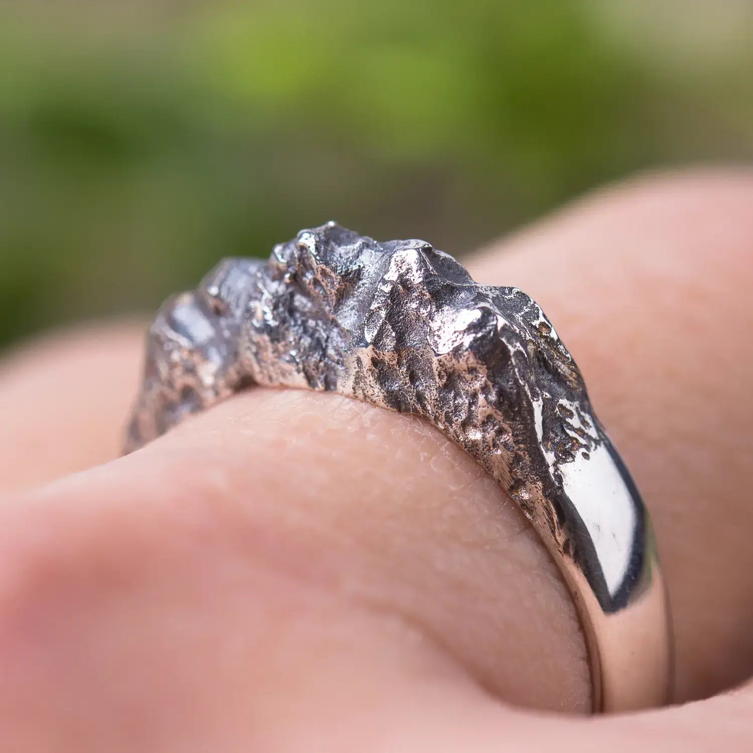 Sterling silver mountain range ring with textured rock design for women, featuring organic style against polished band.