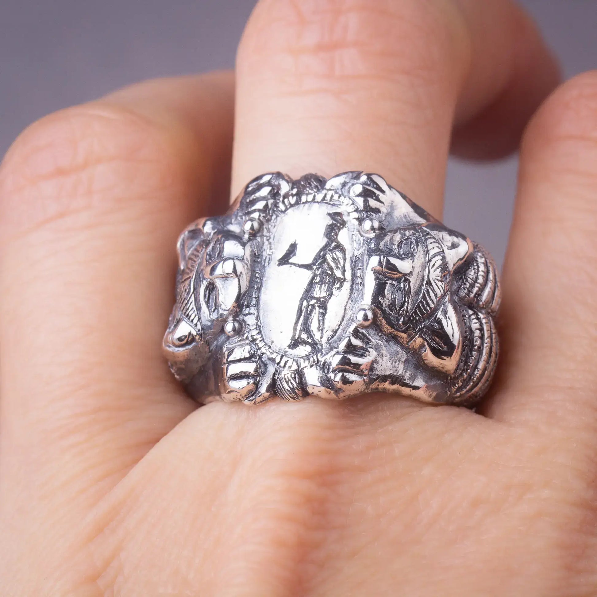 Roman Etruscan Antique Style Ring in sterling silver with lions and goddess design, showcasing craftsmanship and mythological detail.