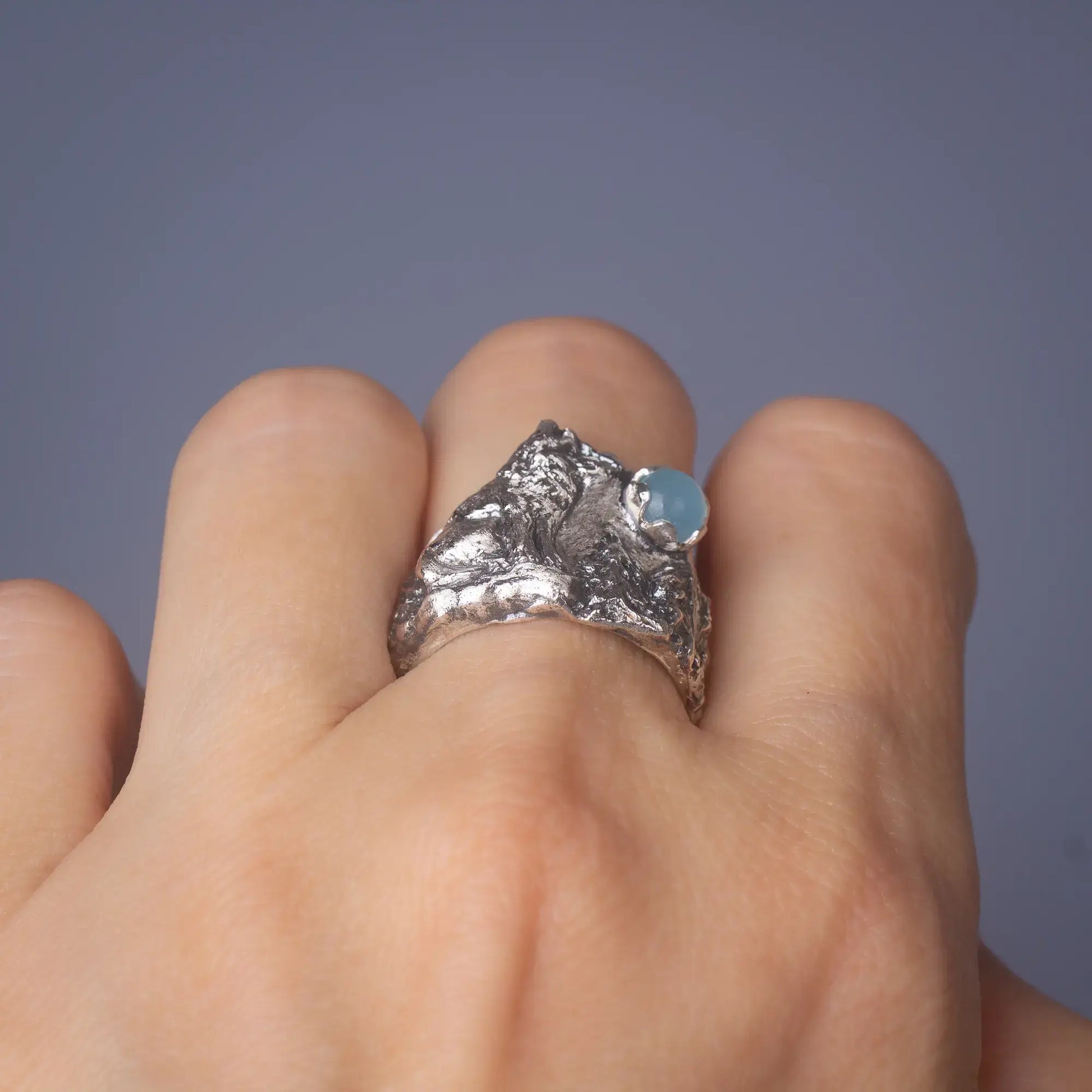  wolf ring in silver with aquamarine Gemstone back view worn on finger