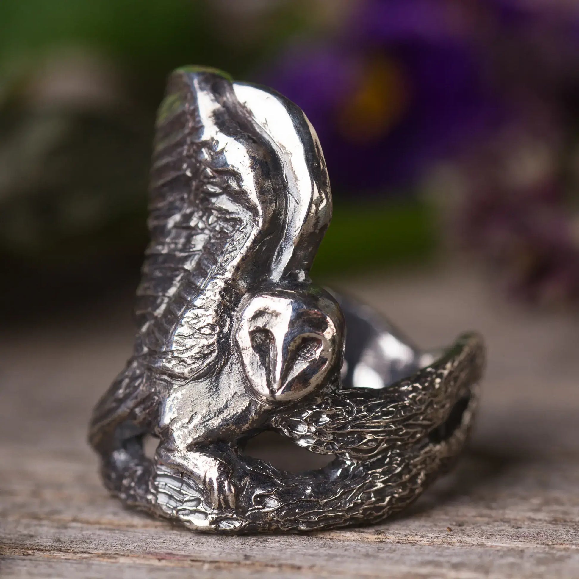 Sterling silver Barn Owl ring with wings spread, sitting on a branch, showcasing bird statement jewelry design.