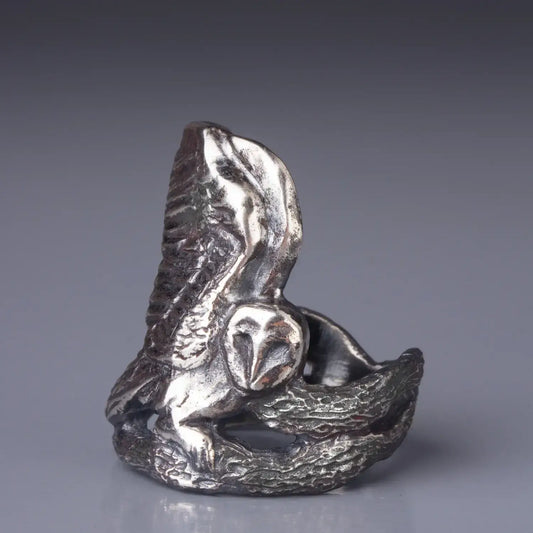 Sterling silver Barn Owl ring with the bird spreading wings and sitting on a tree branch