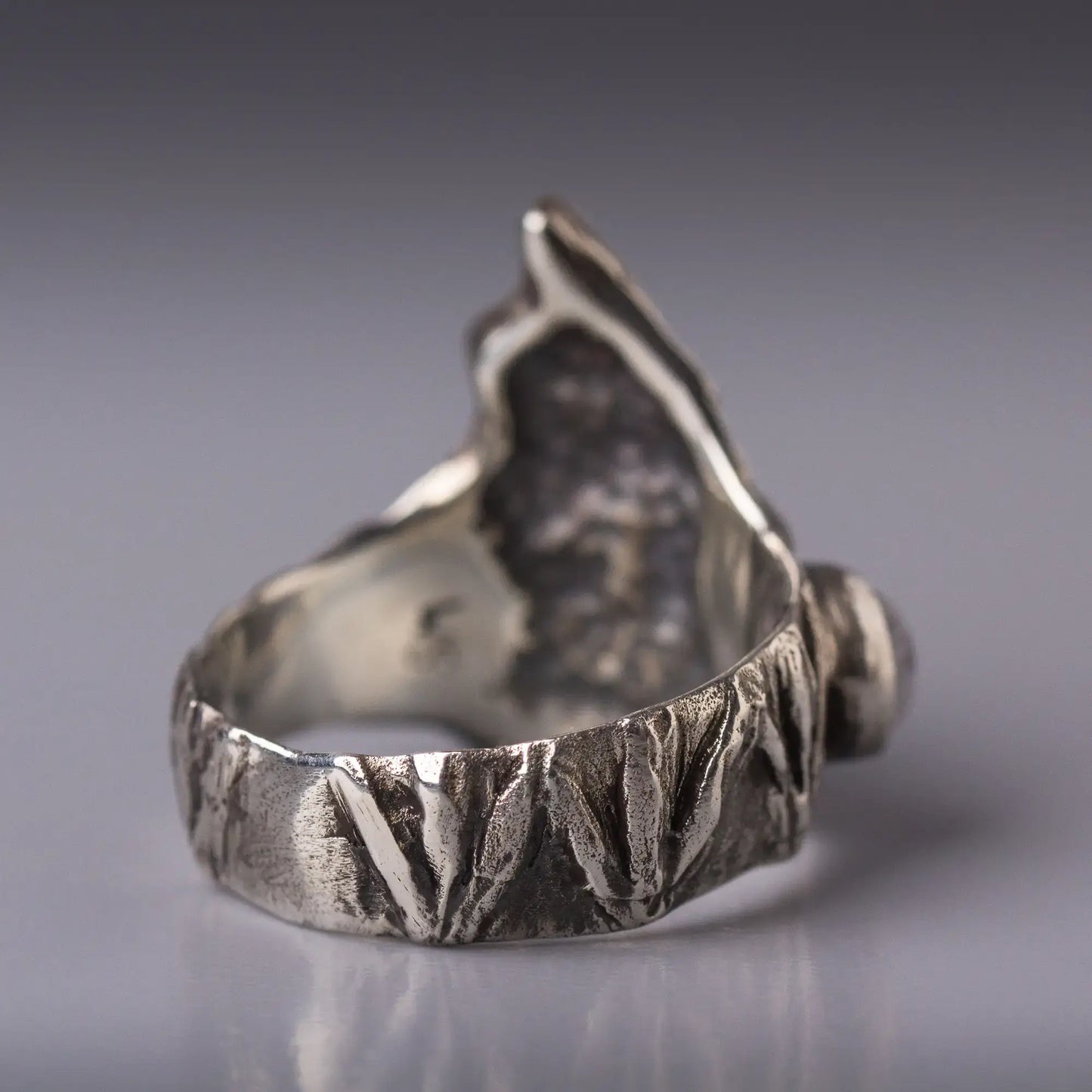 Sterling silver bat ring with detailed wings, showcasing a unique design and intricate craftsmanship.