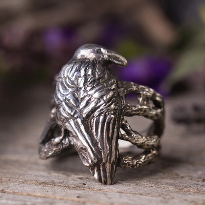 Crow ring in sterling silver with intricate design of a crow on tree branches, handcrafted and perfect for nature lovers.