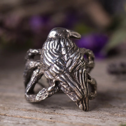 Handcrafted sterling silver crow ring with intricate twig design, perfect for nature lovers and a mystical, statement look.