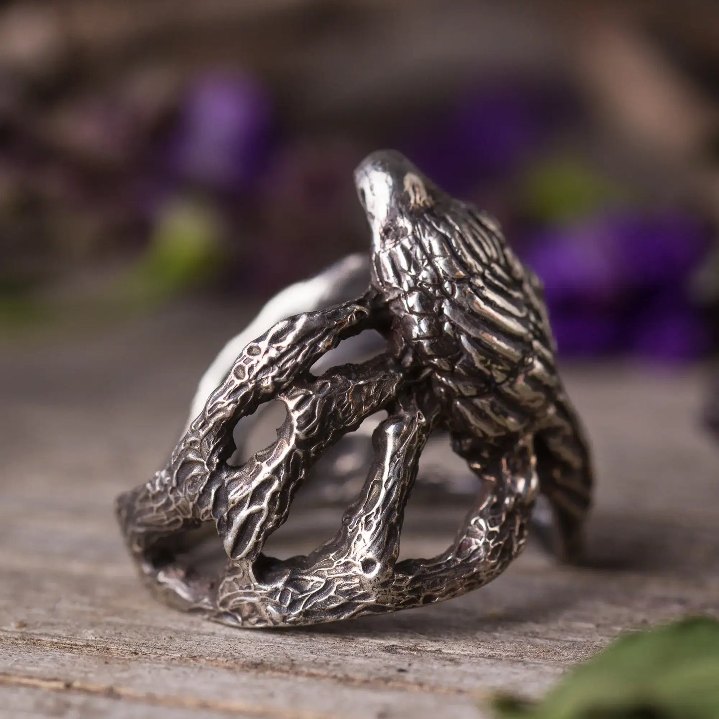 Handcrafted sterling silver crow ring with intricate branch design, perfect for nature and mystical style lovers.