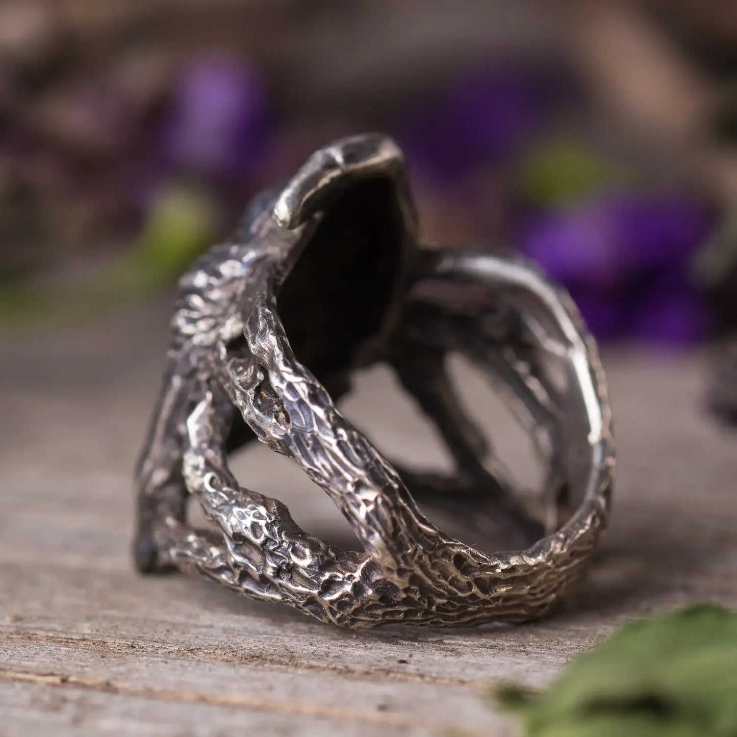 Handcrafted sterling silver crow ring with intricate tree twig design, perfect for nature lovers and those with a mystical style.