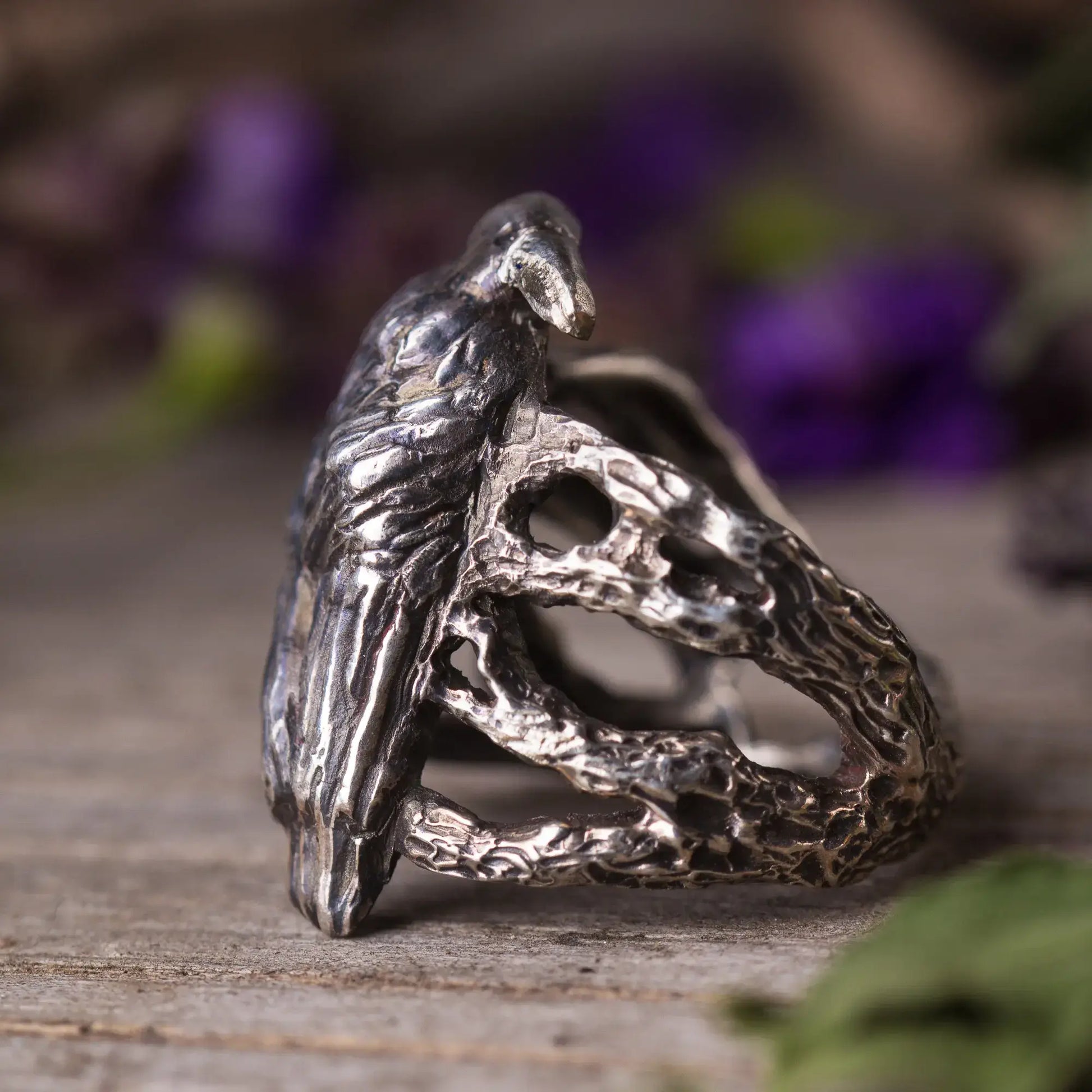 Handcrafted sterling silver crow ring with intricate woodland design, symbolizing nature and mysticism, perfect for nature lovers.