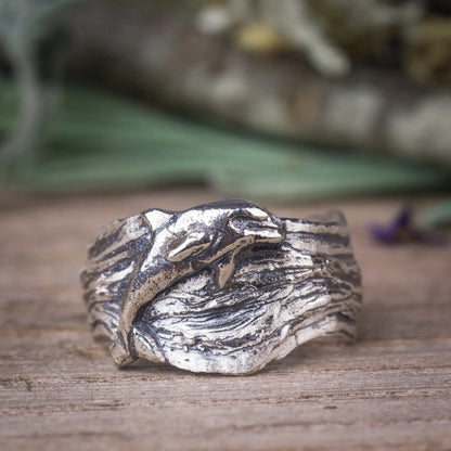 Silver dolphin wide band ring with wavy design, ocean-inspired sea life ring.