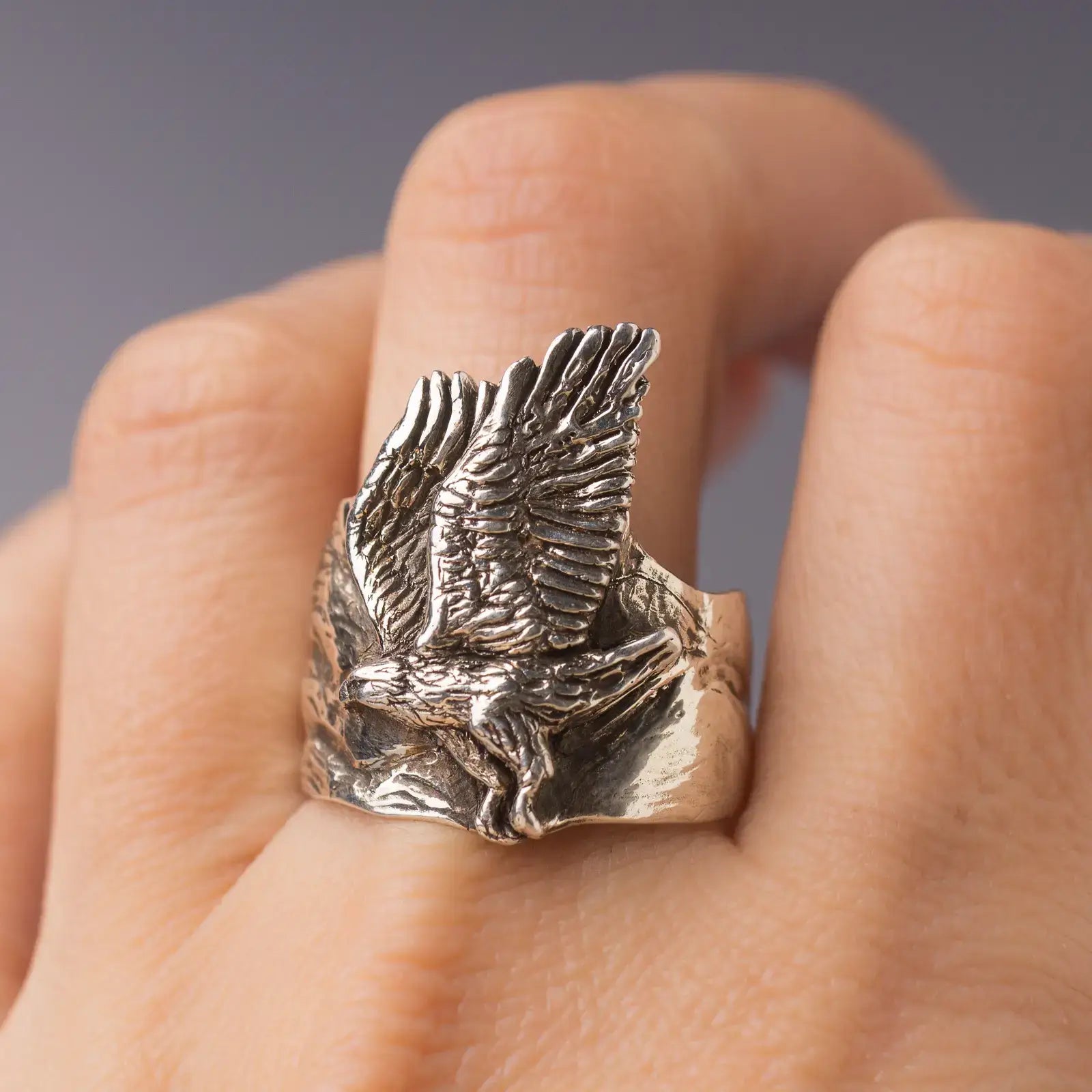 Flying Hawk and Mountain Silver Ring worn on finger