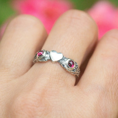 Heart Ring in Silver and Garnet, nature twig design, on the finger front view