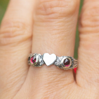 Heart Ring in Silver and Garnet, showing a heart and 2 gemstones on the sides