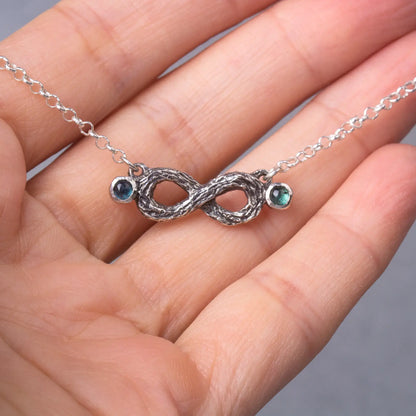 Infinity Twig Silver Pendant necklace with Green Blue Tourmaline, Silver Branch Pendant presented on hand