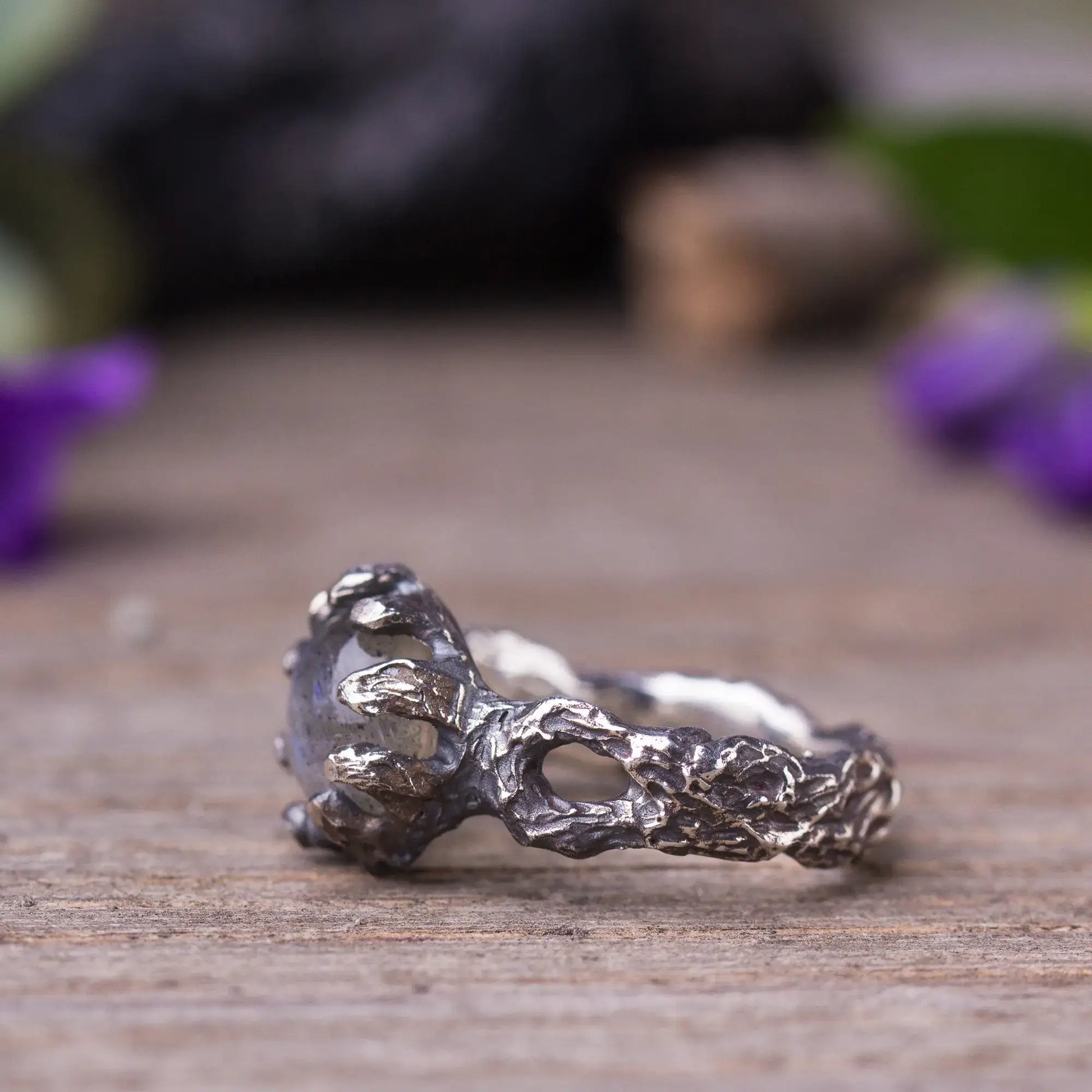 Handcrafted labradorite twig ring in sterling silver with green witch style, featuring intricate branch details and rough-cut gemstone.