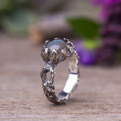 Labradorite twig ring in sterling silver with green witch style, featuring a rough cut gemstone set in a nature-inspired branch design.