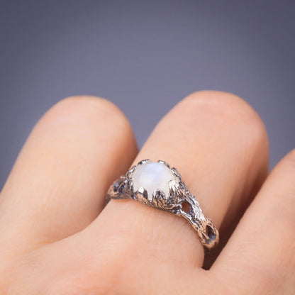 Moonstone twig ring in silver worn on finger