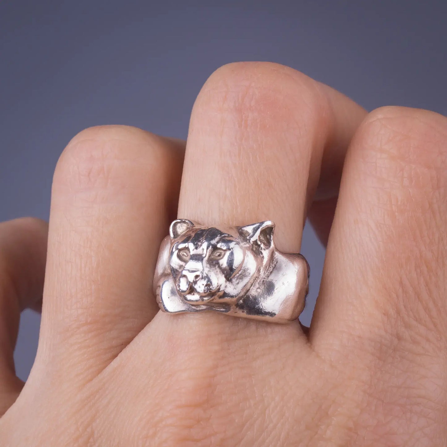 Sterling silver handcrafted spirit animal ring with mountain lion design, symbolizing strength and courage in wildlife jewelry.