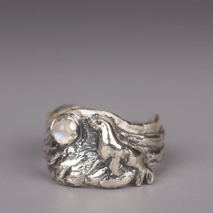 Sterling silver sea lion ring with moonstone, featuring a realistic ocean and rocky beach design, perfect for sea lovers and animal enthusiasts.