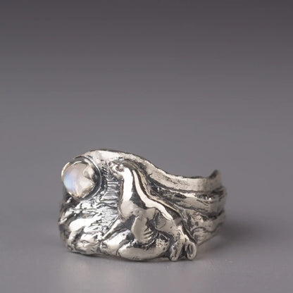 Sterling silver sea lion ring with moonstone, featuring intricate ocean design, perfect for sea lovers and animal enthusiasts.