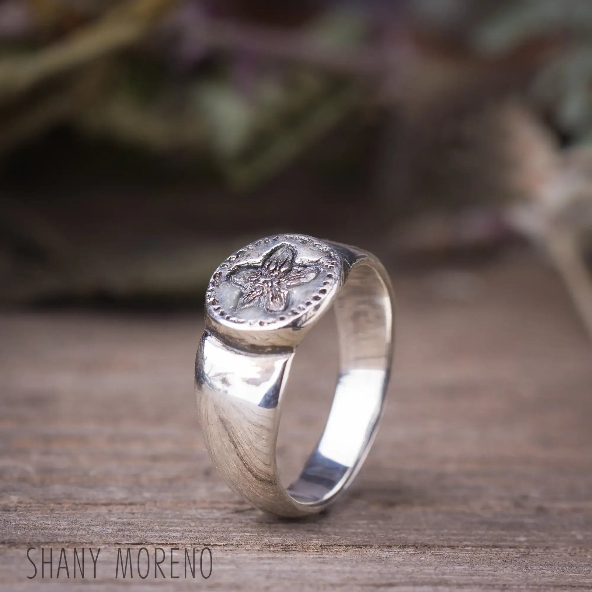 Antique style sterling silver signet ring with carved Pimpernel flower design.