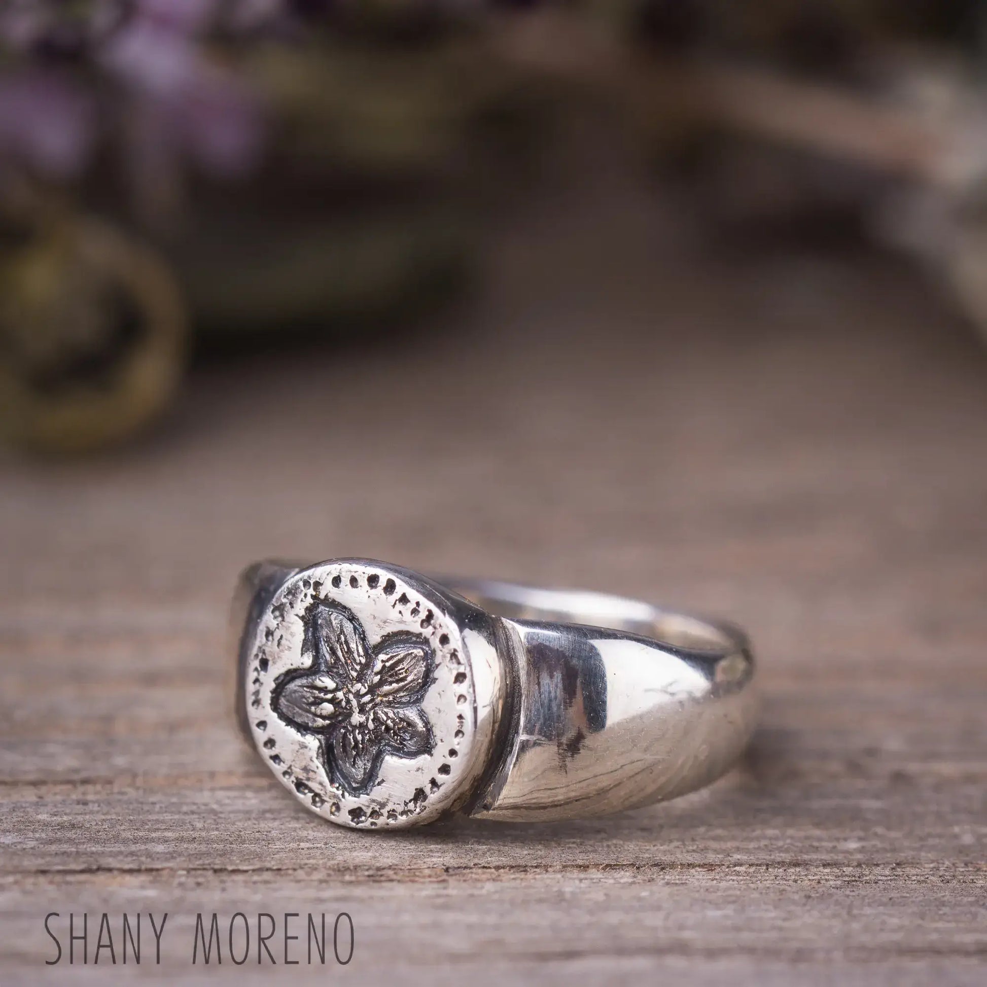 Antique style sterling silver signet ring with hand-carved Pimpernel flower design, showcasing dainty natural beauty.