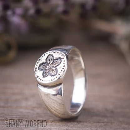 Antique style sterling silver signet ring with hand-carved Pimpernel flower design, featuring dainty flower jewelry details.