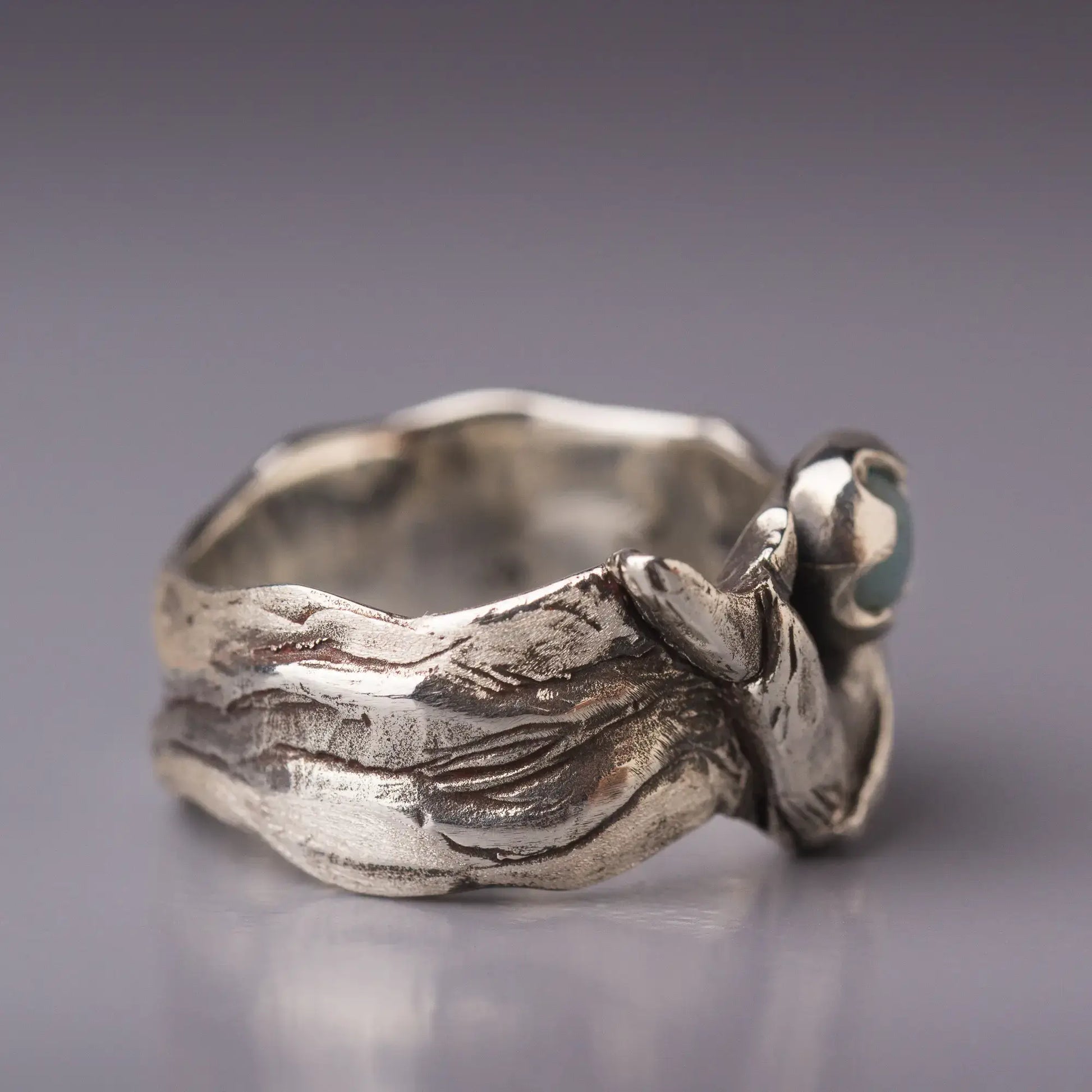 Sterling silver whale ring with Amazonite gemstone, featuring a wide band and Humpback whale design, side view