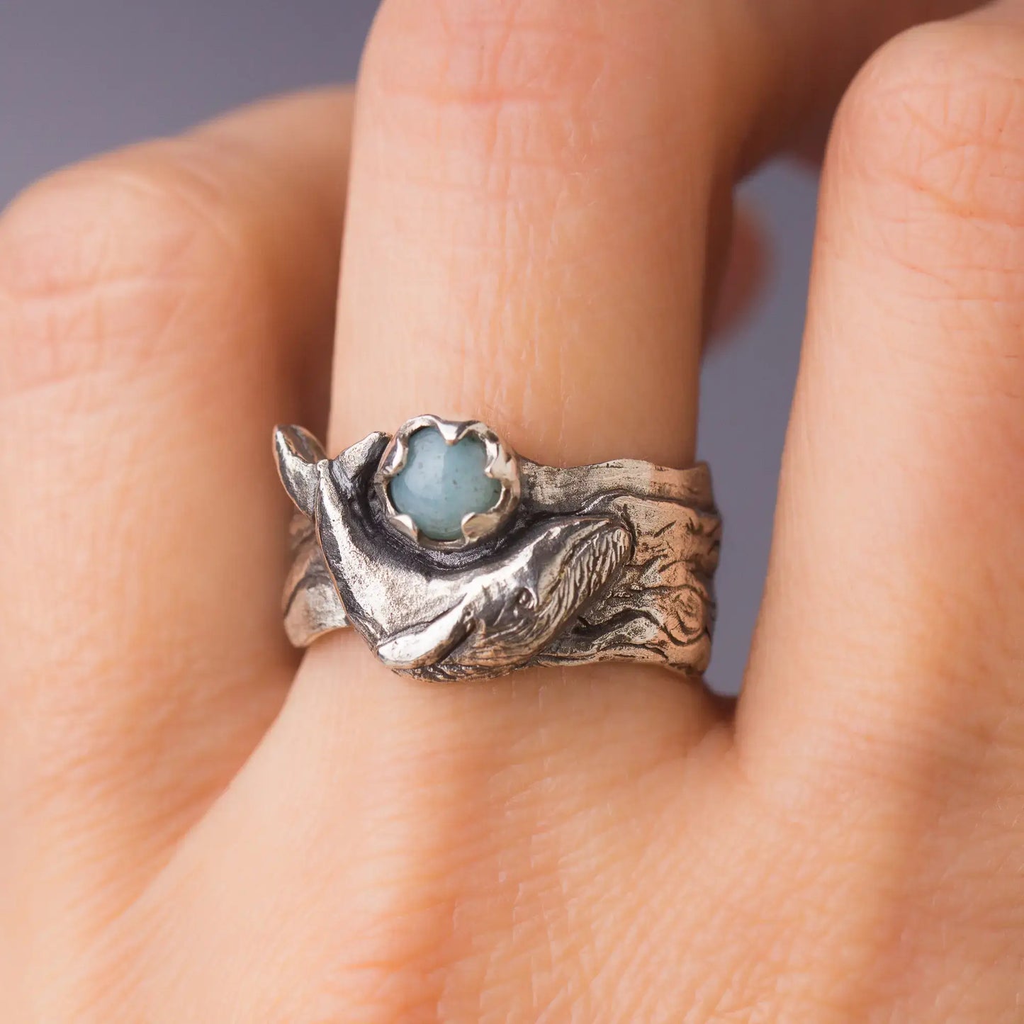 Sterling silver humpback whale ring with Amazonite gemstone on wide band, ocean statement ring on finger.