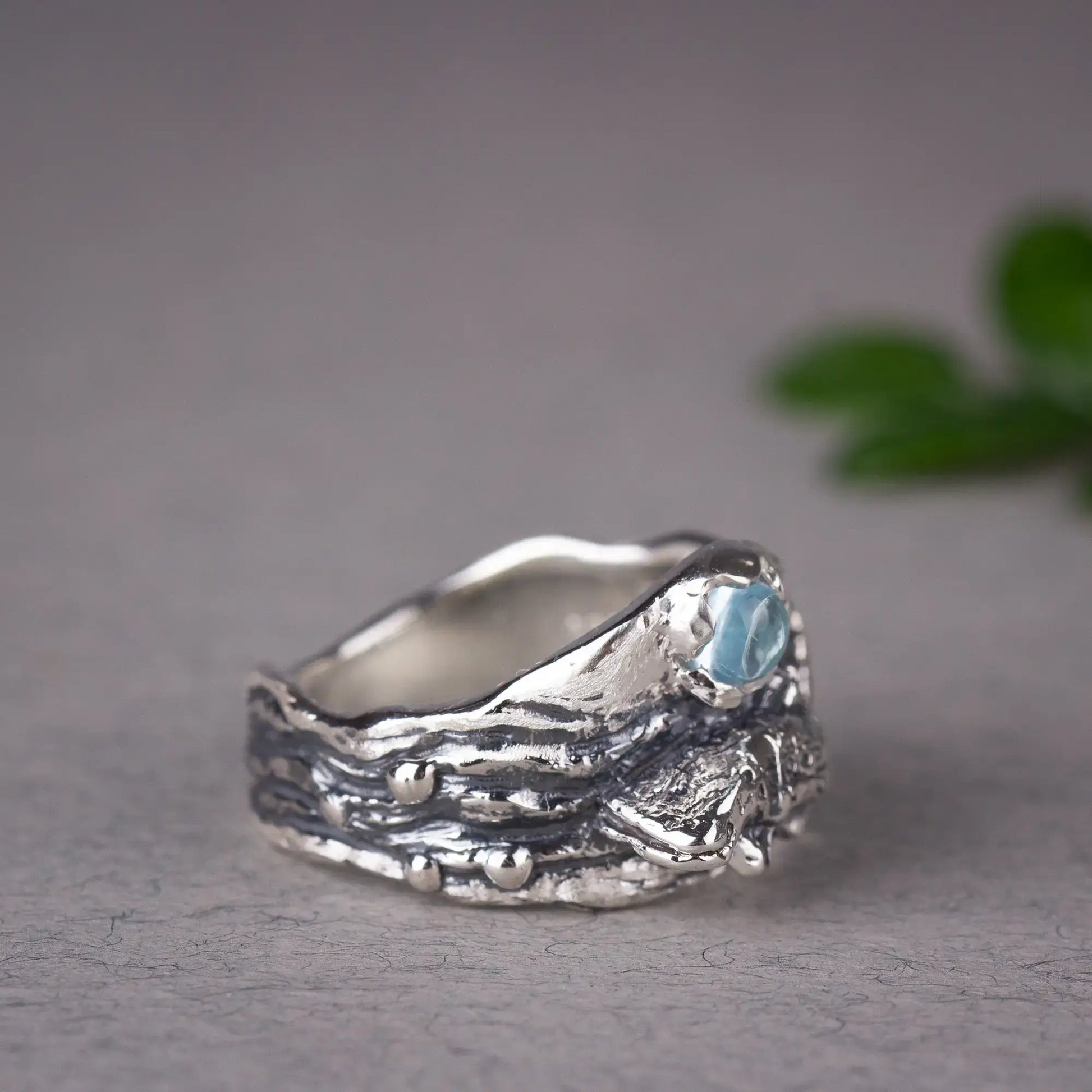 Whale Shark Ring With blue Topaz, grey background, side view