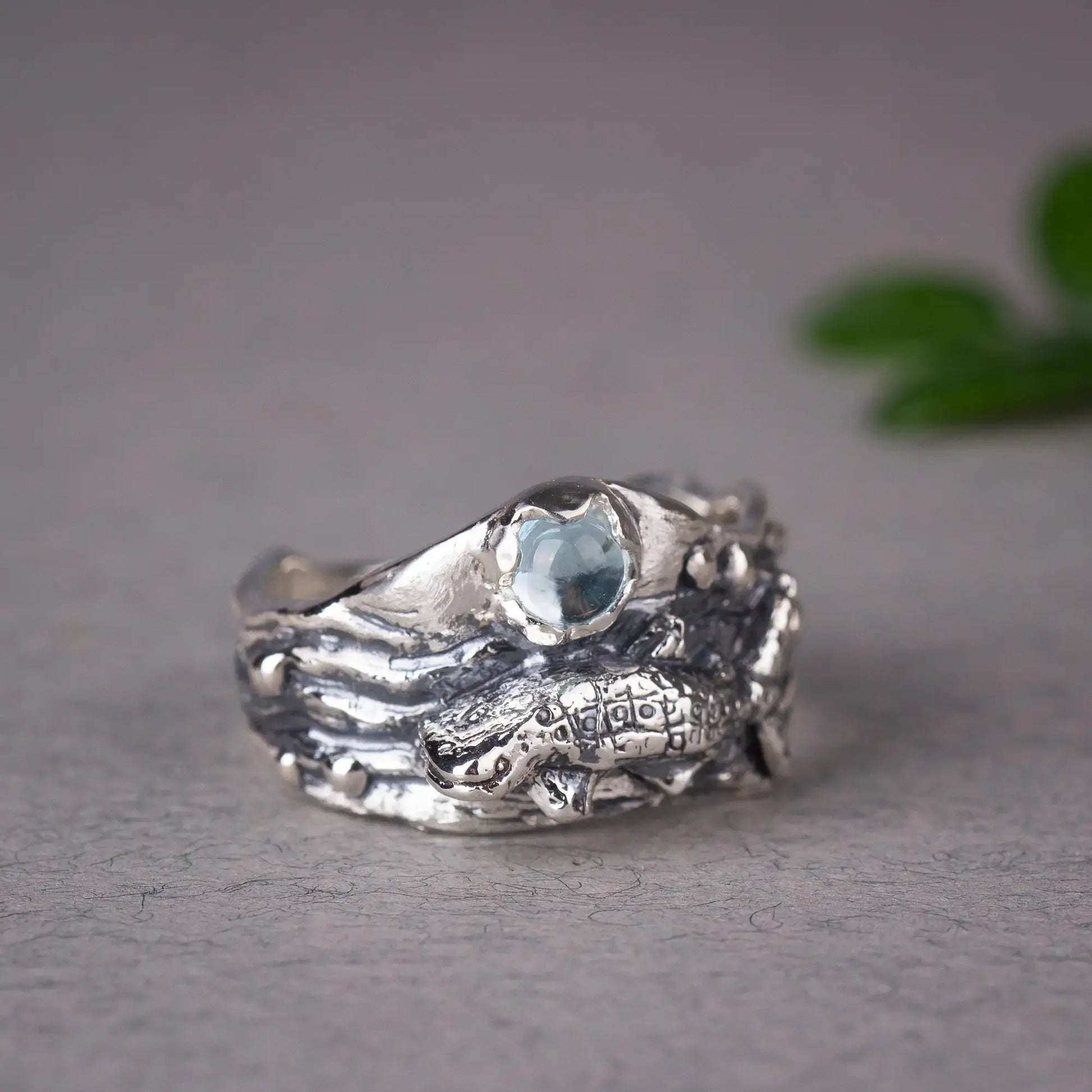 Whale Shark Ring With blue Topaz, grey background, side view