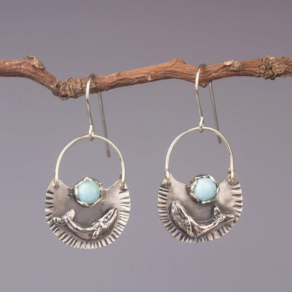 Silver humpback whale dangle earrings with Larimar gemstones, ocean style statement jewelry.