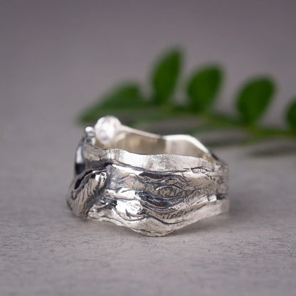 Sterling silver wide band ring featuring detailed humpback whale design on the band, ocean-inspired jewelry gift.