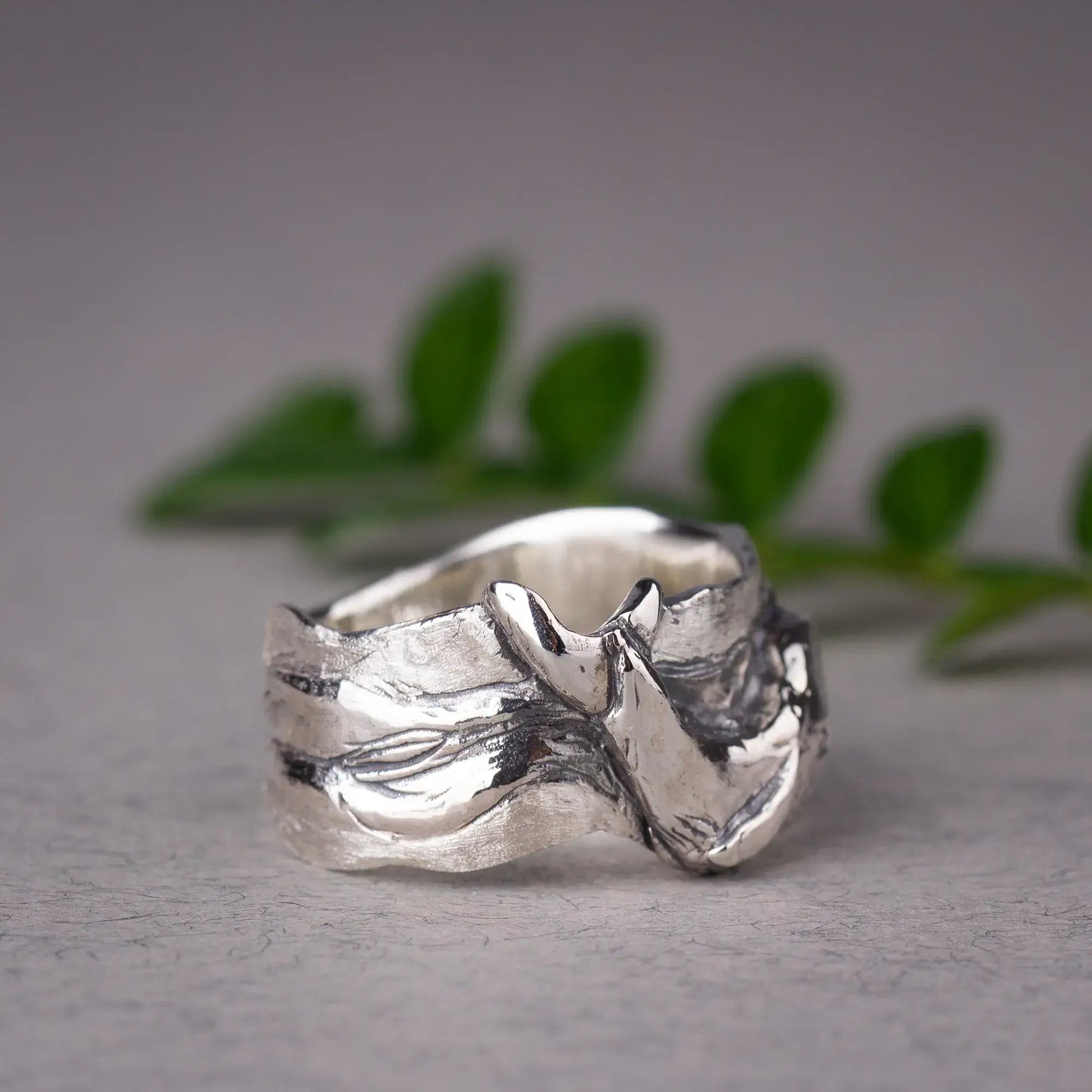 Sterling silver whale ring with detailed humpback whale design on a wide band ring, inspired by ocean and sea animals.